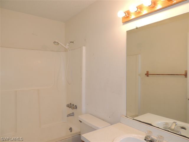 8175 Matanzas Road Fort Myers, FL 33967 - Photo 7 of 12 a bathroom with a sink and a shower