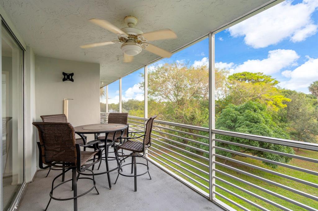 4020 West Palm Aire Drive, Unit 312 Pompano Beach, FL 33069 - Photo 22 of 36 a view of a dining room with furniture window and outside view