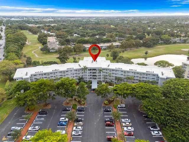 a view of a street with potted plants