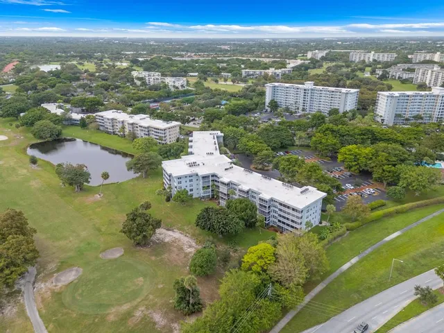 an aerial view of city and lake