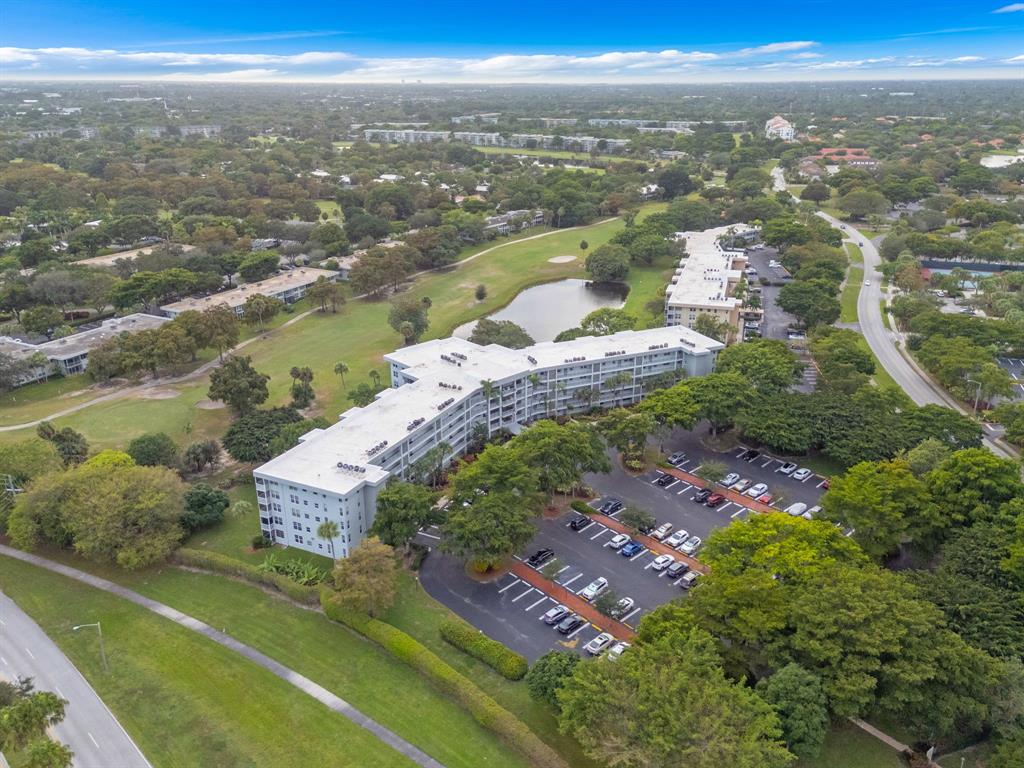 4020 West Palm Aire Drive, Unit 312 Pompano Beach, FL 33069 - Photo 35 of 36 an aerial view of city and lake