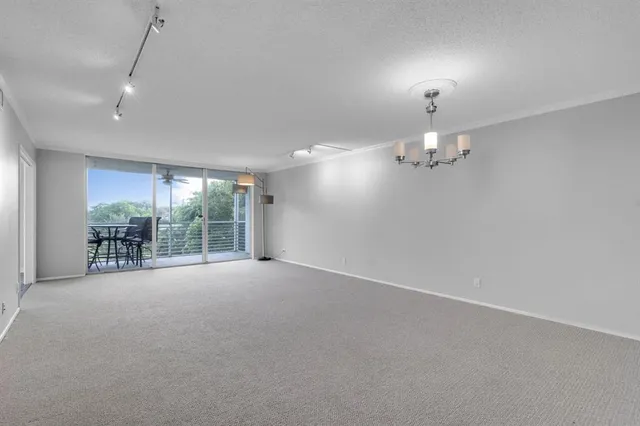 en empty room with windows and outdoor view