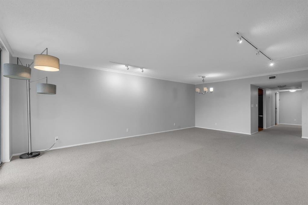 4020 West Palm Aire Drive, Unit 312 Pompano Beach, FL 33069 - Photo 10 of 36 an empty room with a empty space and windows