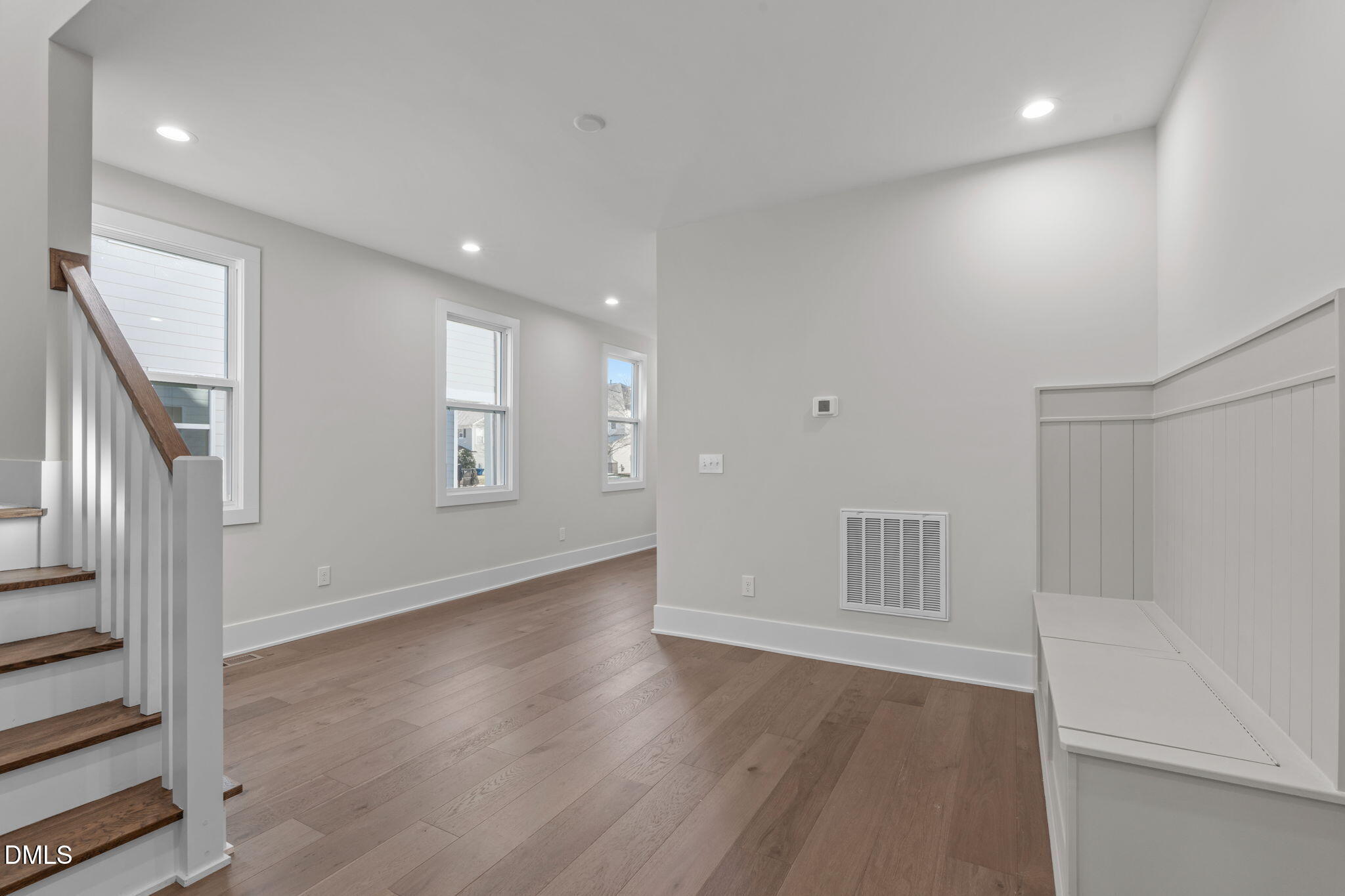 639 Conover Road, Unit B Durham, NC 27703 - Photo 12 of 48 a view of an empty room with wooden floor and a window