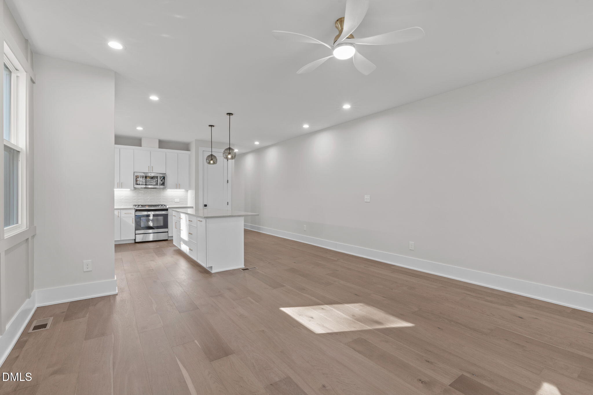 639 Conover Road, Unit B Durham, NC 27703 - Photo 22 of 48 a view of a kitchen with a sink and wooden floor