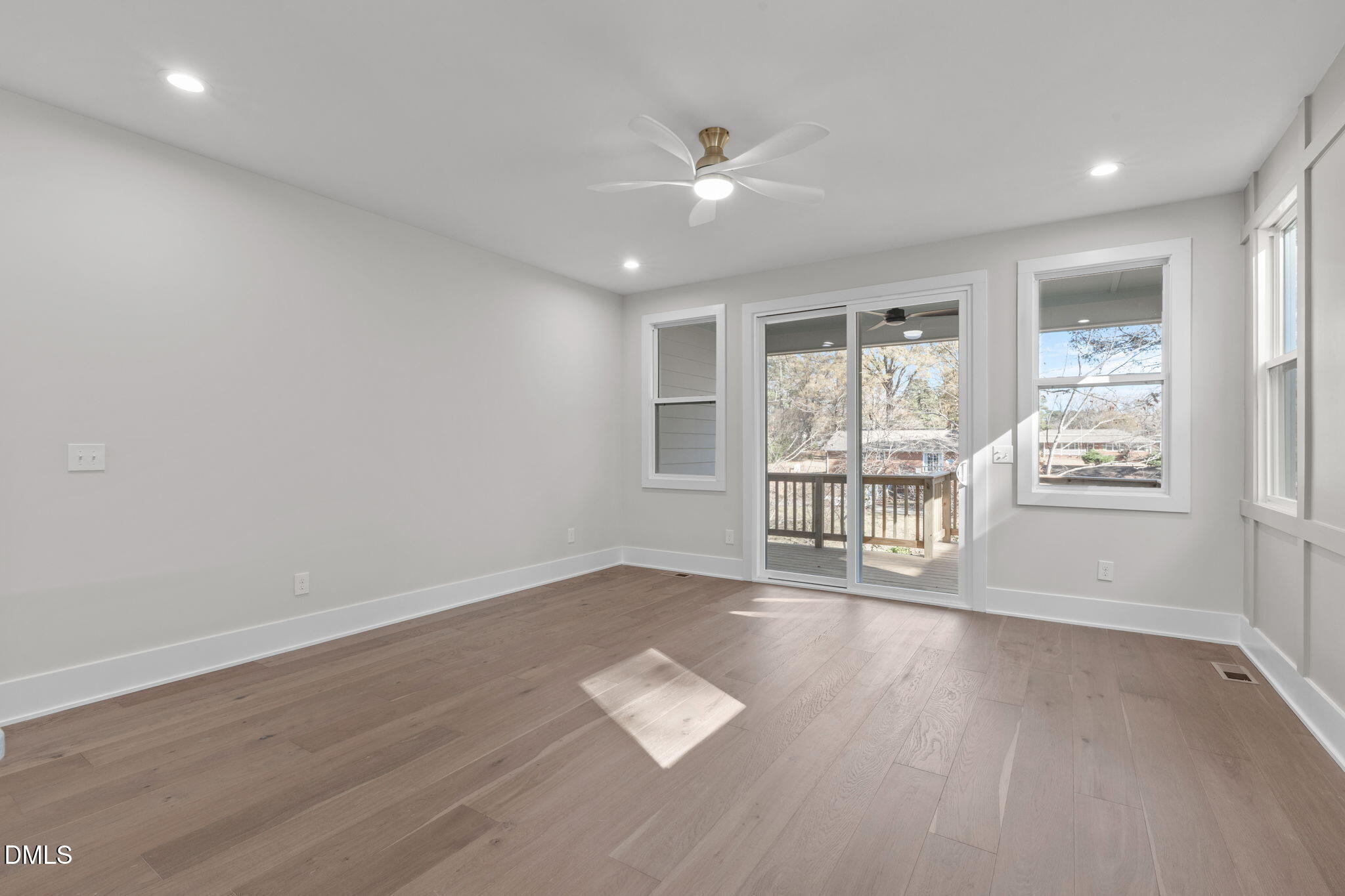 639 Conover Road, Unit B Durham, NC 27703 - Photo 23 of 48 a view of an empty room with a window and wooden floor