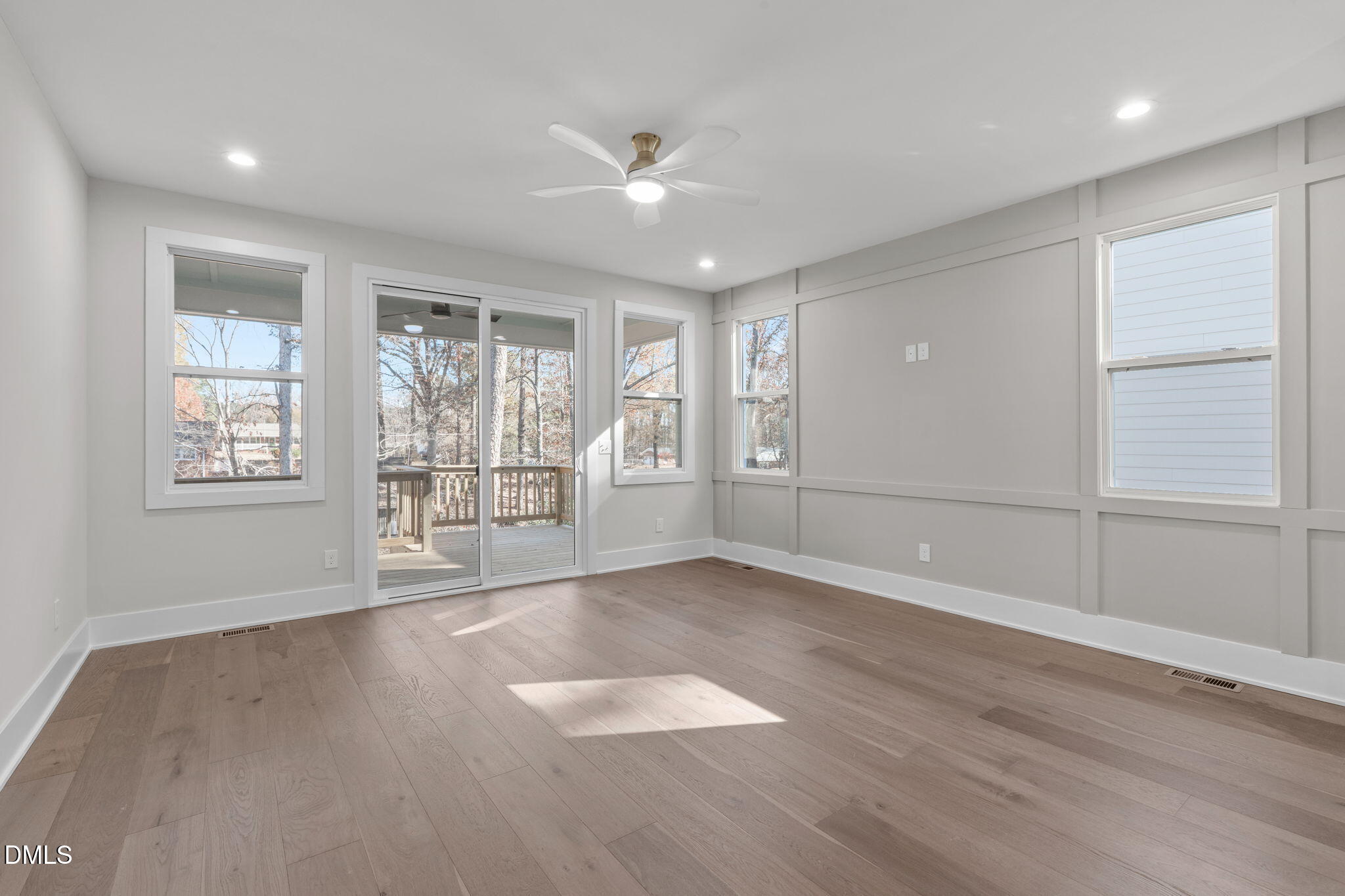 639 Conover Road, Unit B Durham, NC 27703 - Photo 2 of 48 an empty room with wooden floor and windows
