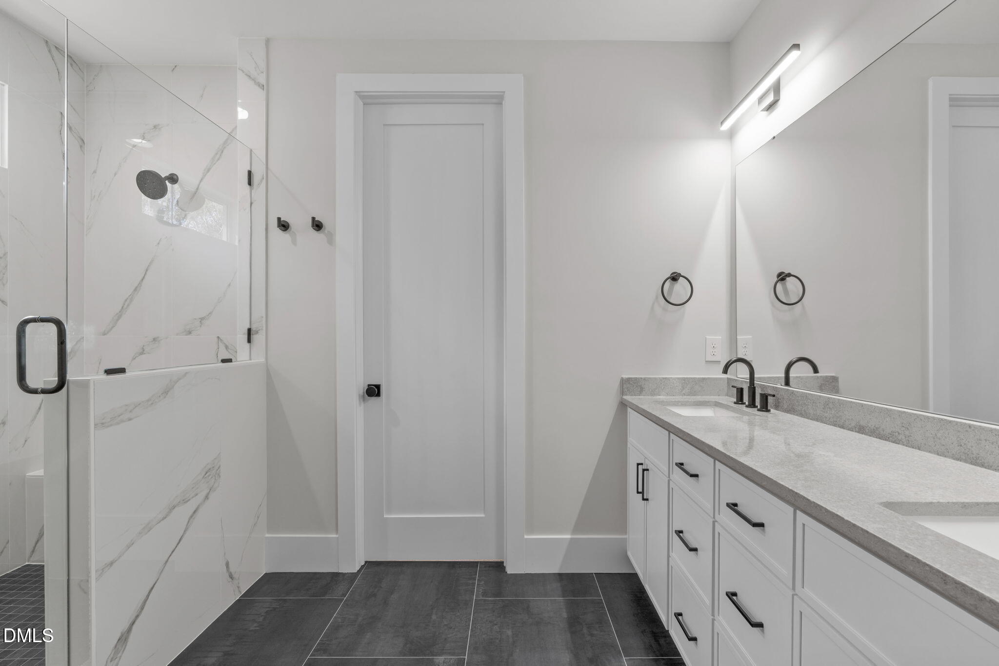 639 Conover Road, Unit B Durham, NC 27703 - Photo 4 of 48 a bathroom with a granite countertop sink a mirror and a shower