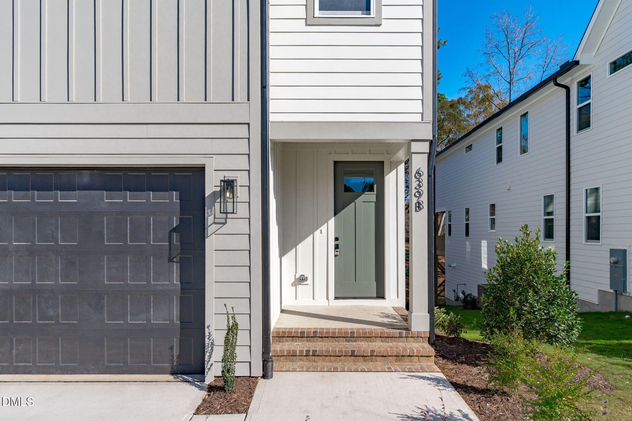639 Conover Road, Unit B Durham, NC 27703 - Photo 6 of 48 a front view of a house with a garage