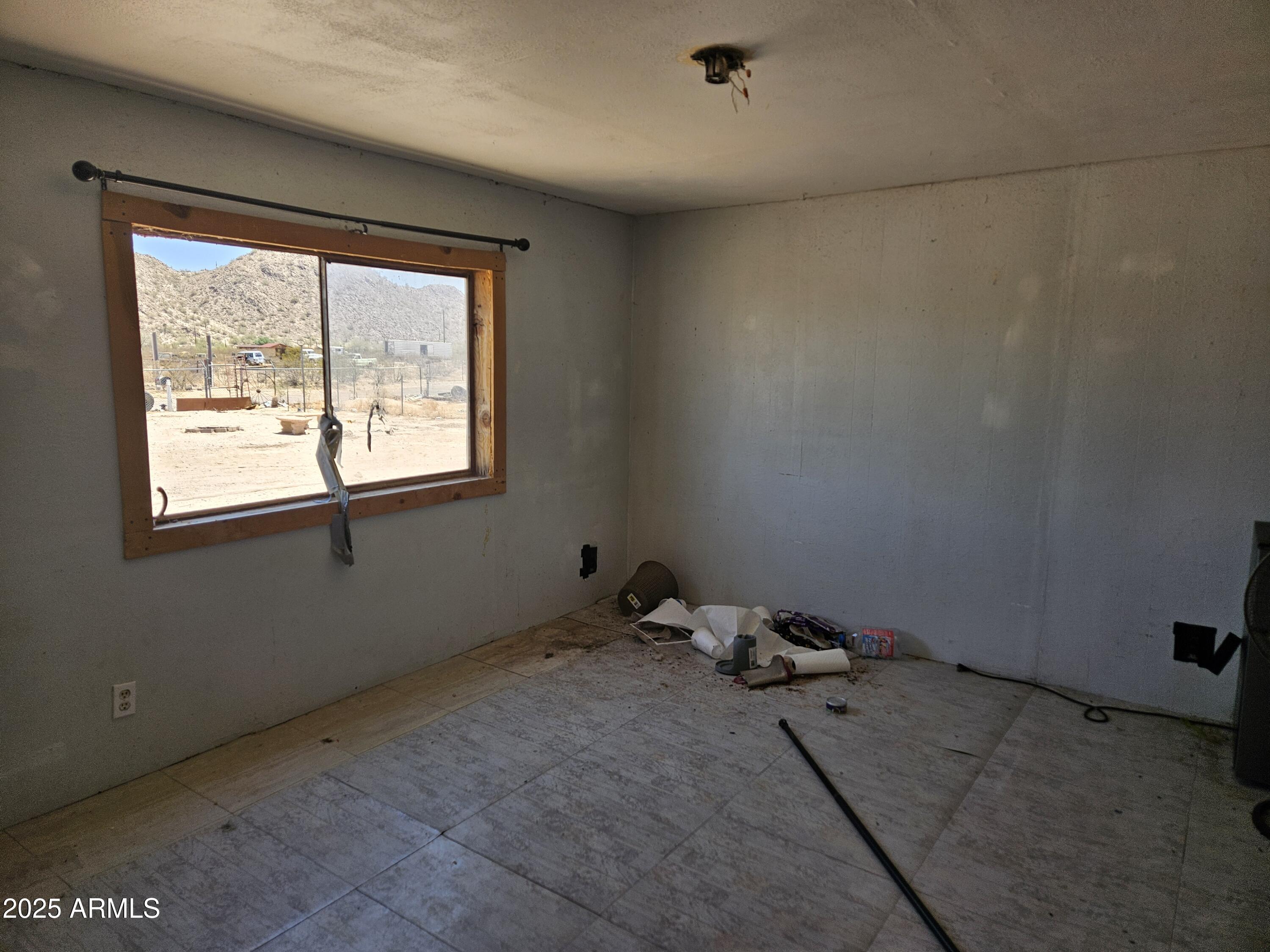 684 South Conejo Road Maricopa, AZ 85139 - Photo 4 of 10 a room with a window