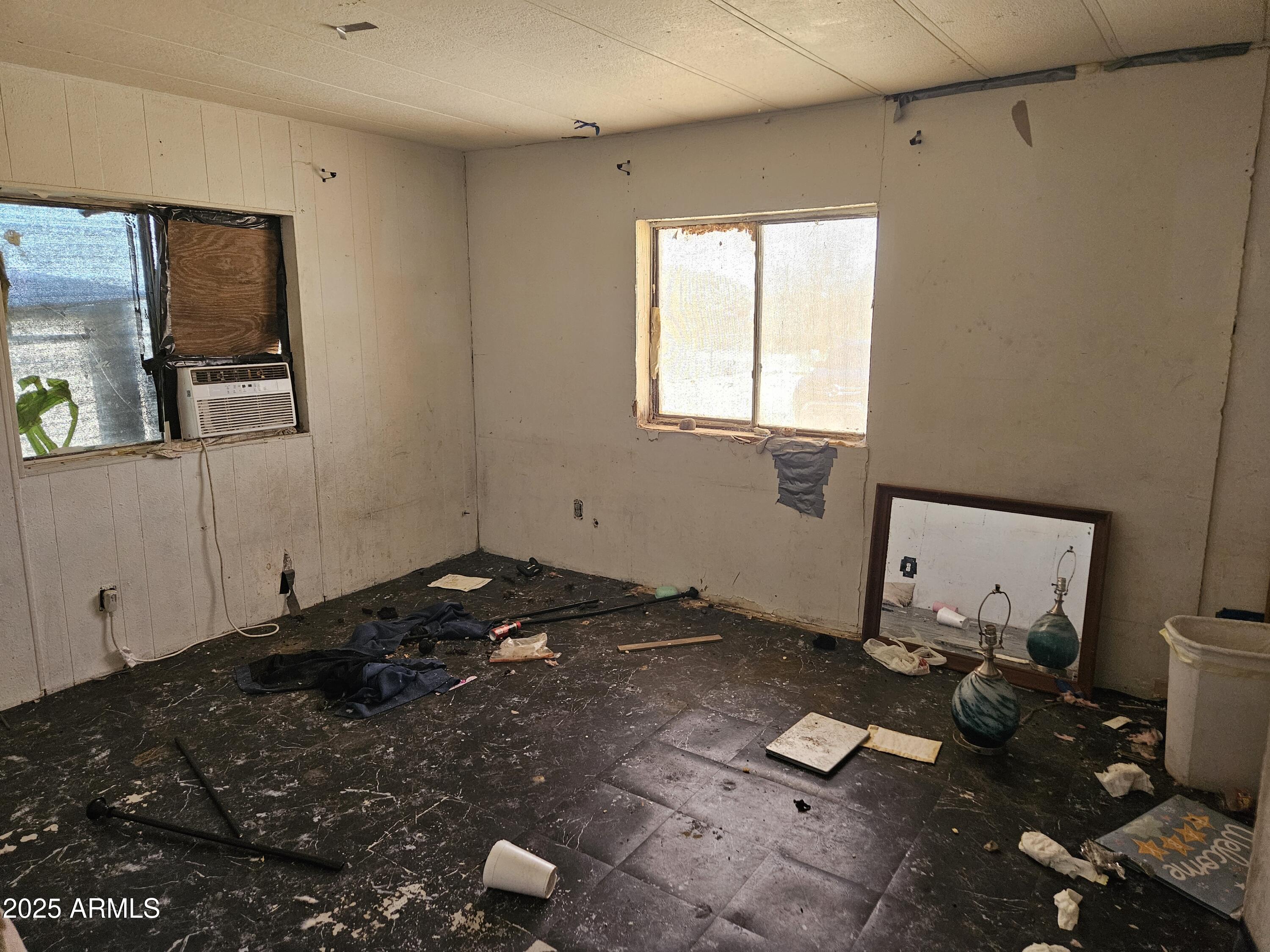 684 South Conejo Road Maricopa, AZ 85139 - Photo 8 of 10 a bedroom with a bed and wooden floor