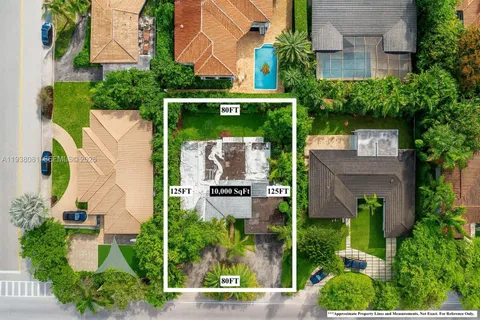 an aerial view of a house with a garden and plants