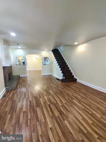 a view of a room with wooden floor