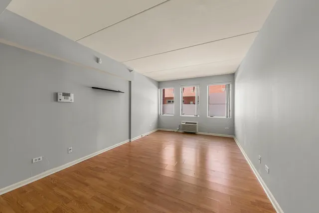 a view of a livingroom with wooden floor