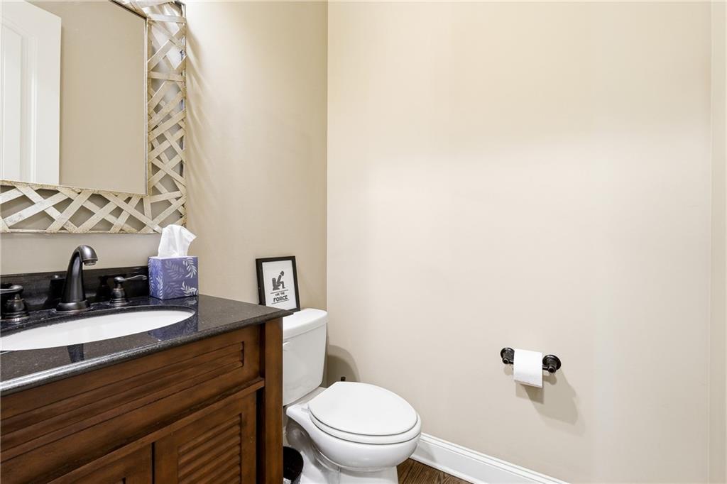 265 Trecastle Square Canton, GA 30114 - Photo 13 of 47 a bathroom with a toilet a sink and mirror