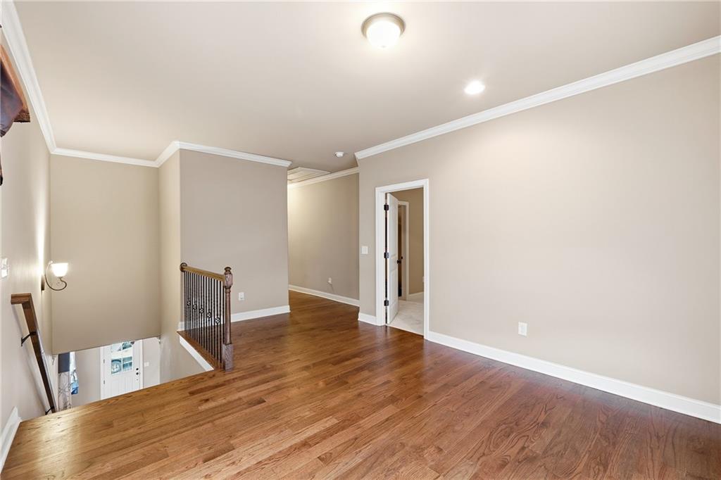 265 Trecastle Square Canton, GA 30114 - Photo 21 of 47 a view of an empty room with wooden floor