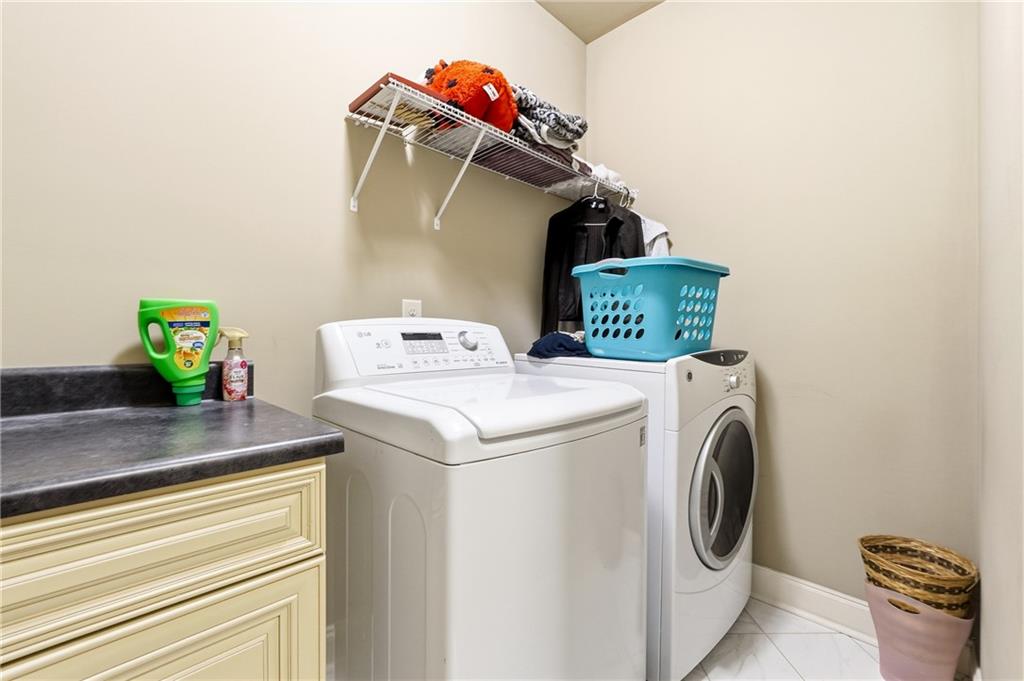 265 Trecastle Square Canton, GA 30114 - Photo 29 of 47 a utility room with dryer and washer