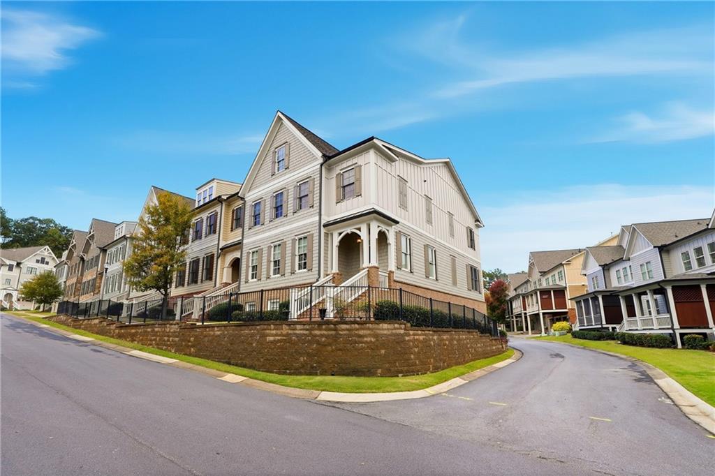 265 Trecastle Square Canton, GA 30114 - Photo 5 of 47 a front view of a house with swimming pool