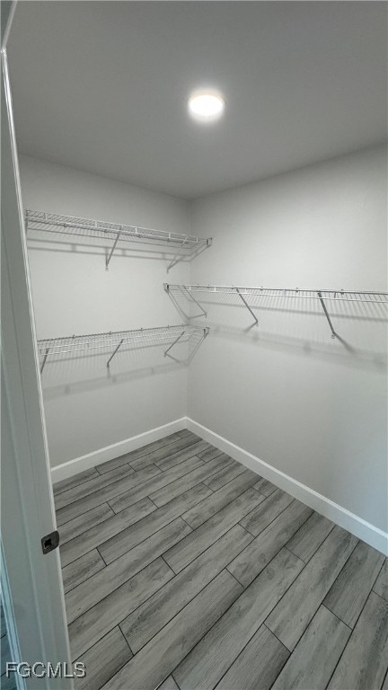 3314 36th Street Southwest Lehigh Acres, FL 33976 - Photo 20 of 23 a view of a room with racks on the wall