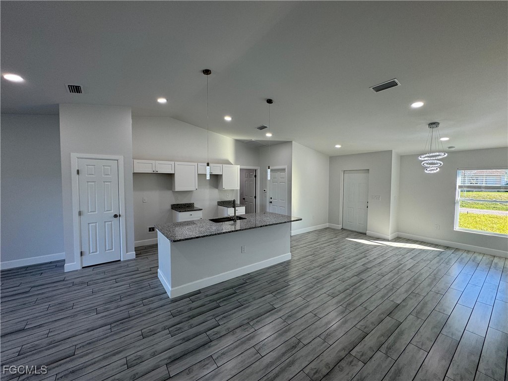 3314 36th Street Southwest Lehigh Acres, FL 33976 - Photo 9 of 23 a view of kitchen and kitchen with stainless steel appliances