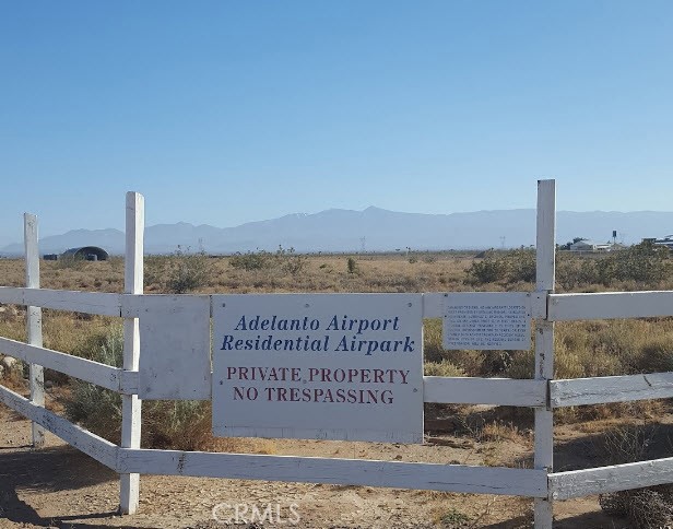 0 Poppy Adelanto, CA 92301 - Photo 1 of 1 a sign on the side of a building