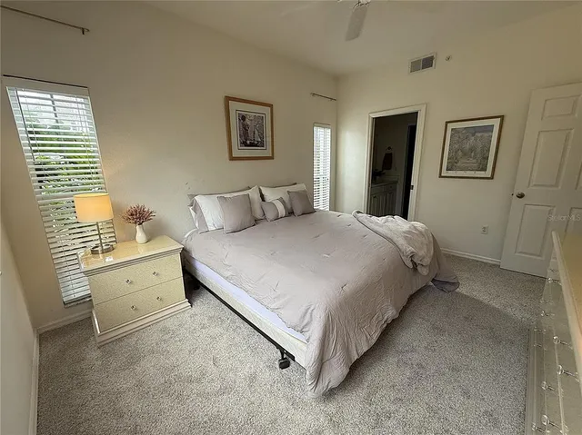 a bed room with a bed and a table