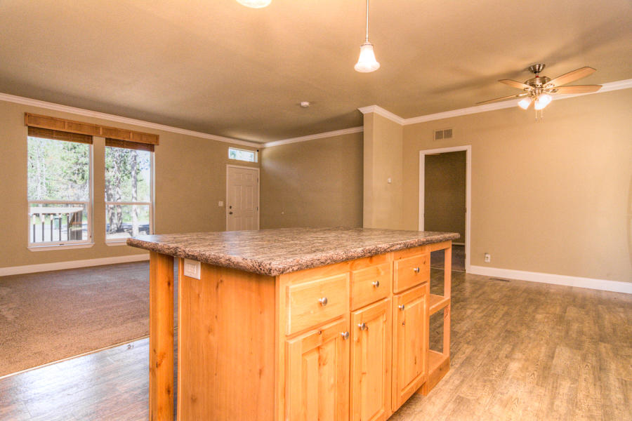 56264 Black Duck Road Bend, OR 97707 - Photo 9 of 31 The kitchen island has lots of storage.
