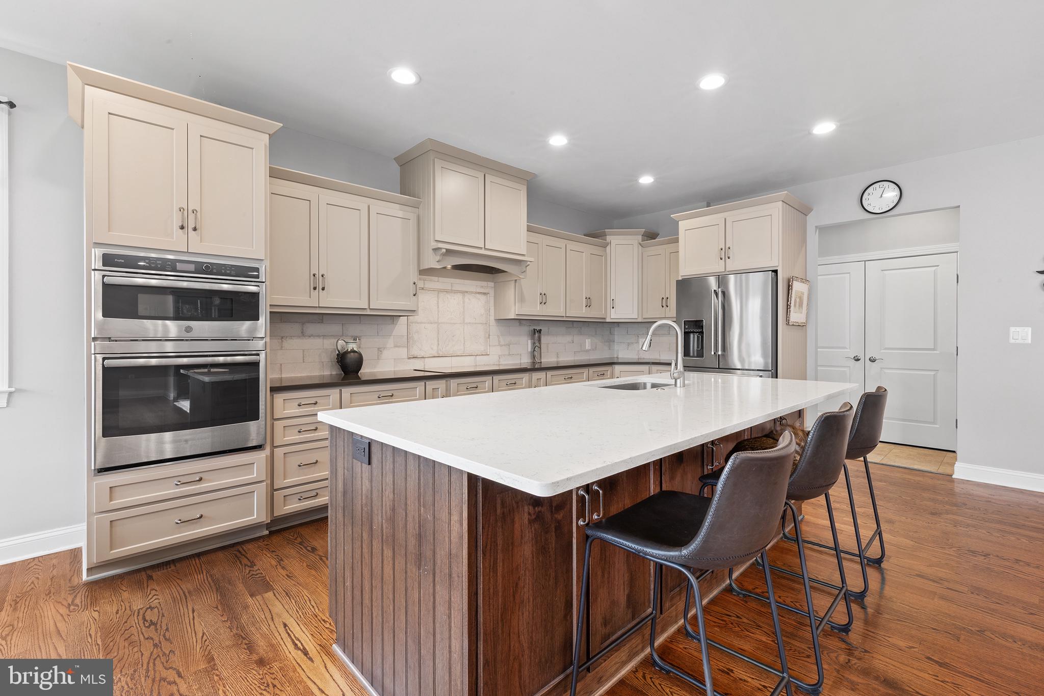 60 Cooper Lane Gettysburg, PA 17325 - Photo 12 of 51 a kitchen with stainless steel appliances kitchen island granite countertop a kitchen island hardwood floor sink and stove