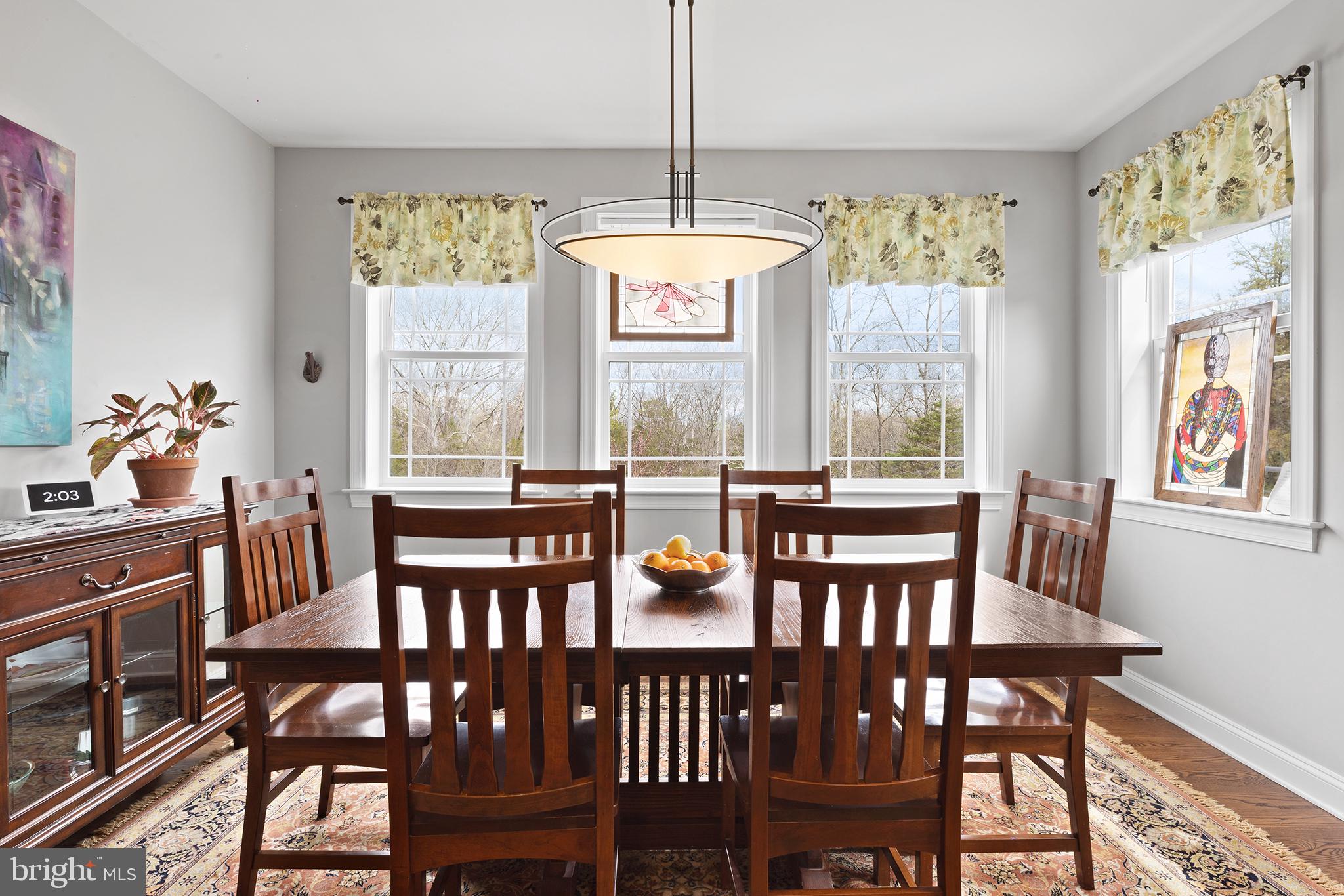 60 Cooper Lane Gettysburg, PA 17325 - Photo 15 of 51 a view of a dining room with furniture a chandelier and wooden floor