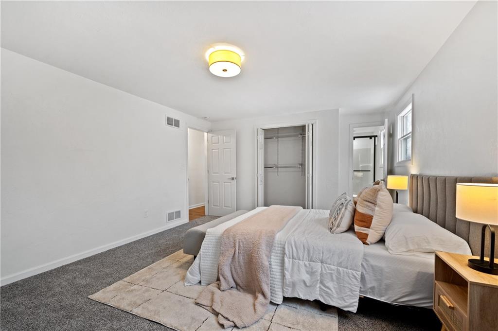 200 Pinchtown Road Pittsburgh, PA 15236 - Photo 15 of 26 a bedroom with a bed and painting on the wall