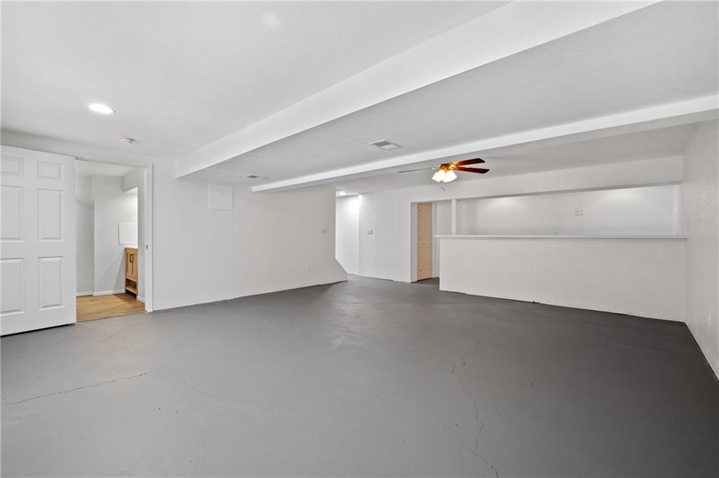 200 Pinchtown Road Pittsburgh, PA 15236 - Photo 20 of 26 a view of a livingroom with an empty space and a window