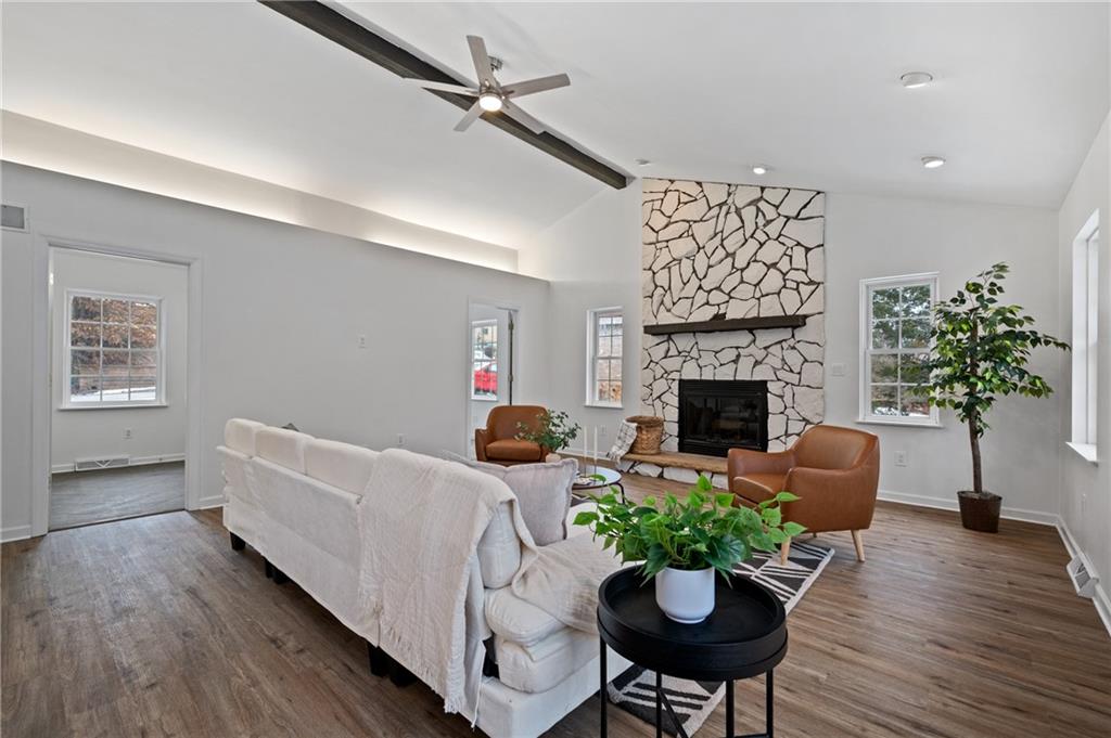 200 Pinchtown Road Pittsburgh, PA 15236 - Photo 2 of 26 a living room with furniture a fireplace and a potted plant