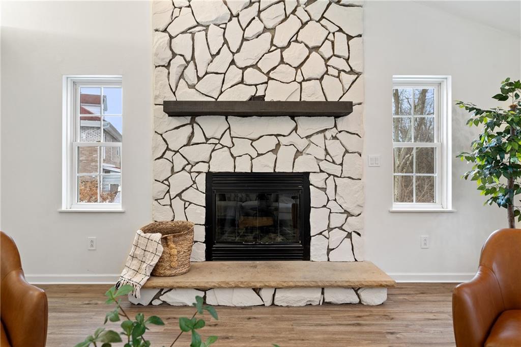 200 Pinchtown Road Pittsburgh, PA 15236 - Photo 3 of 26 a living room with furniture a fireplace and a table