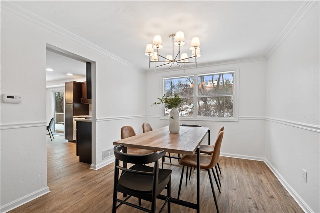 200 Pinchtown Road Pittsburgh, PA 15236 - Photo 9 of 26 a view of a dining room with furniture and wooden floor