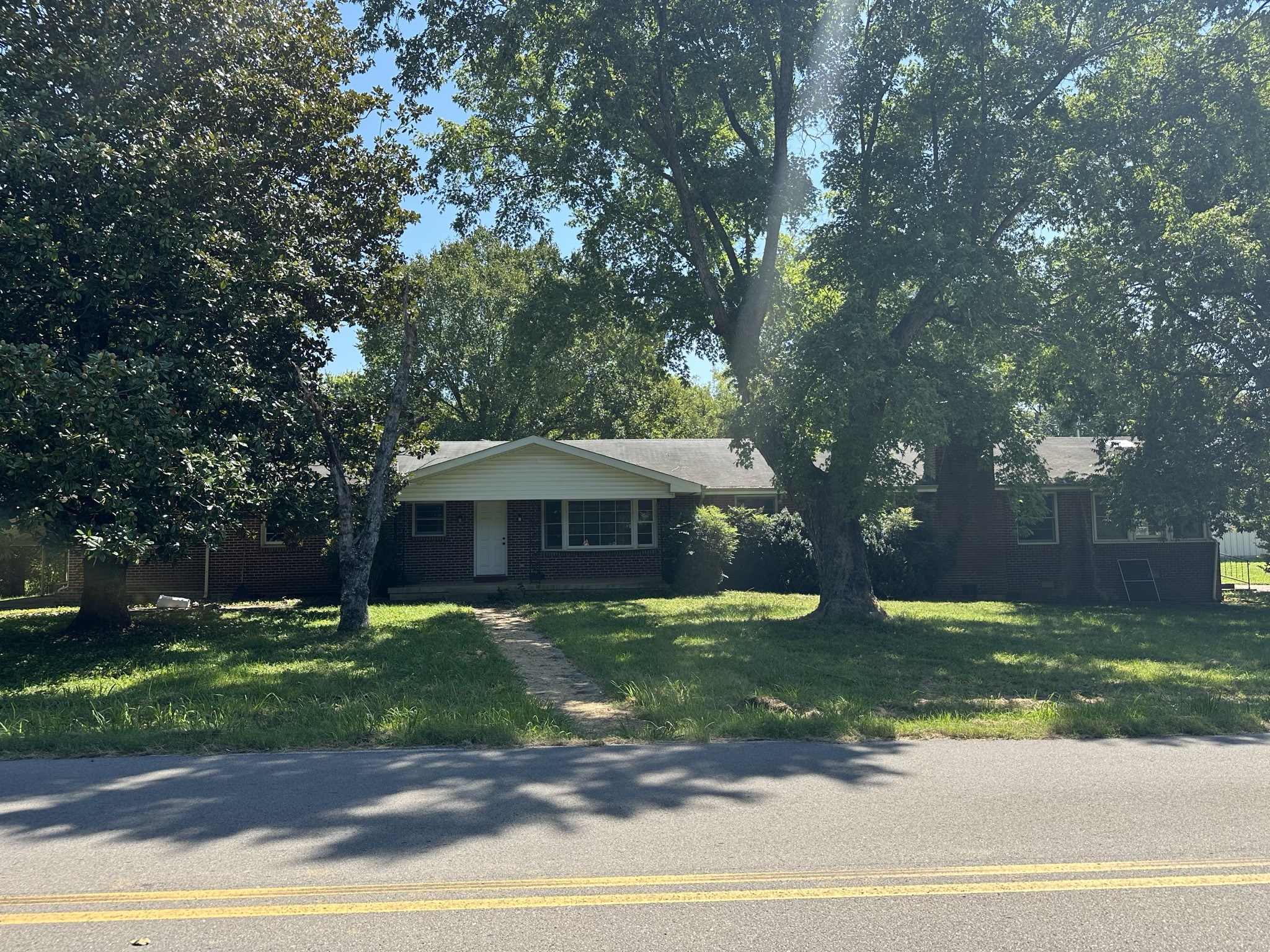 10026 Mona Road Murfreesboro, TN 37129 - Photo 39 of 64 a front view of a house with garden