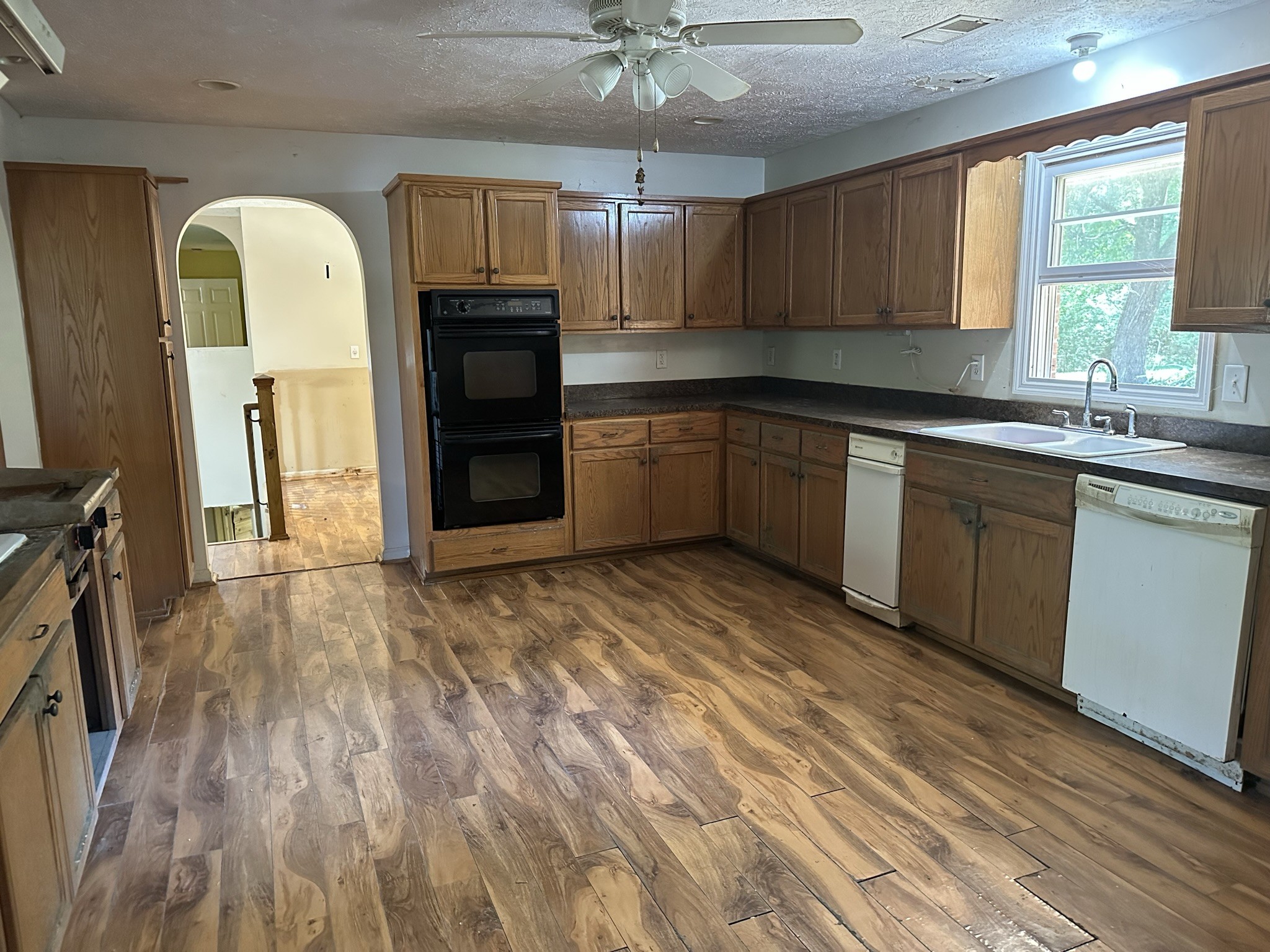 10026 Mona Road Murfreesboro, TN 37129 - Photo 50 of 64 a kitchen with stainless steel appliances granite countertop a stove cabinets and wooden floor