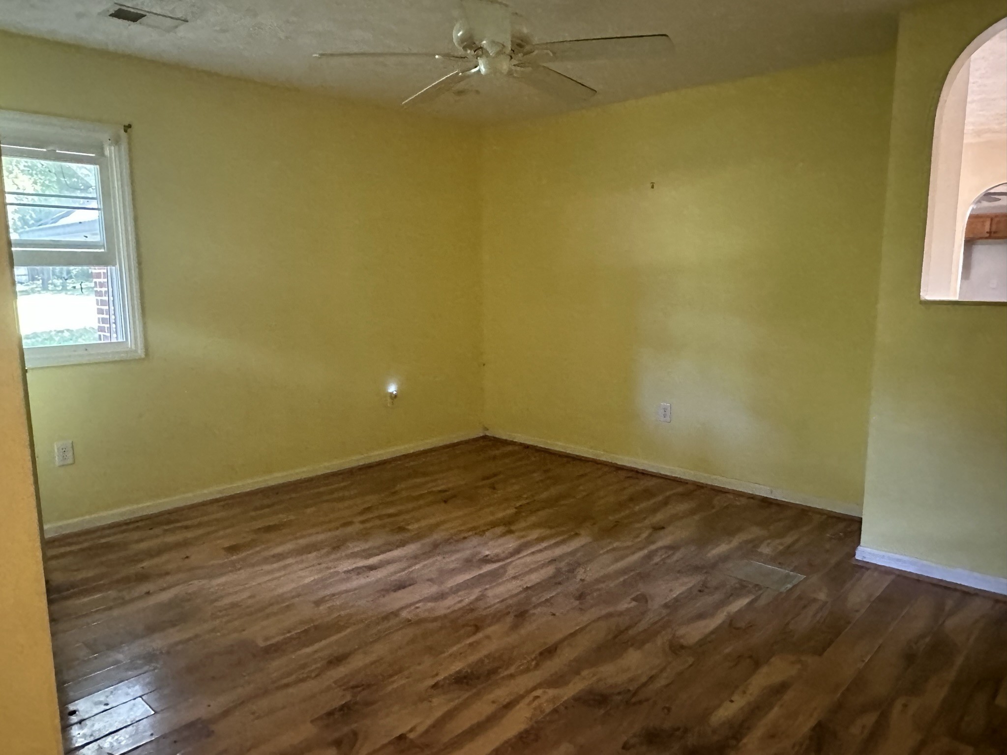 10026 Mona Road Murfreesboro, TN 37129 - Photo 53 of 64 a view of an empty room with wooden floor and a window