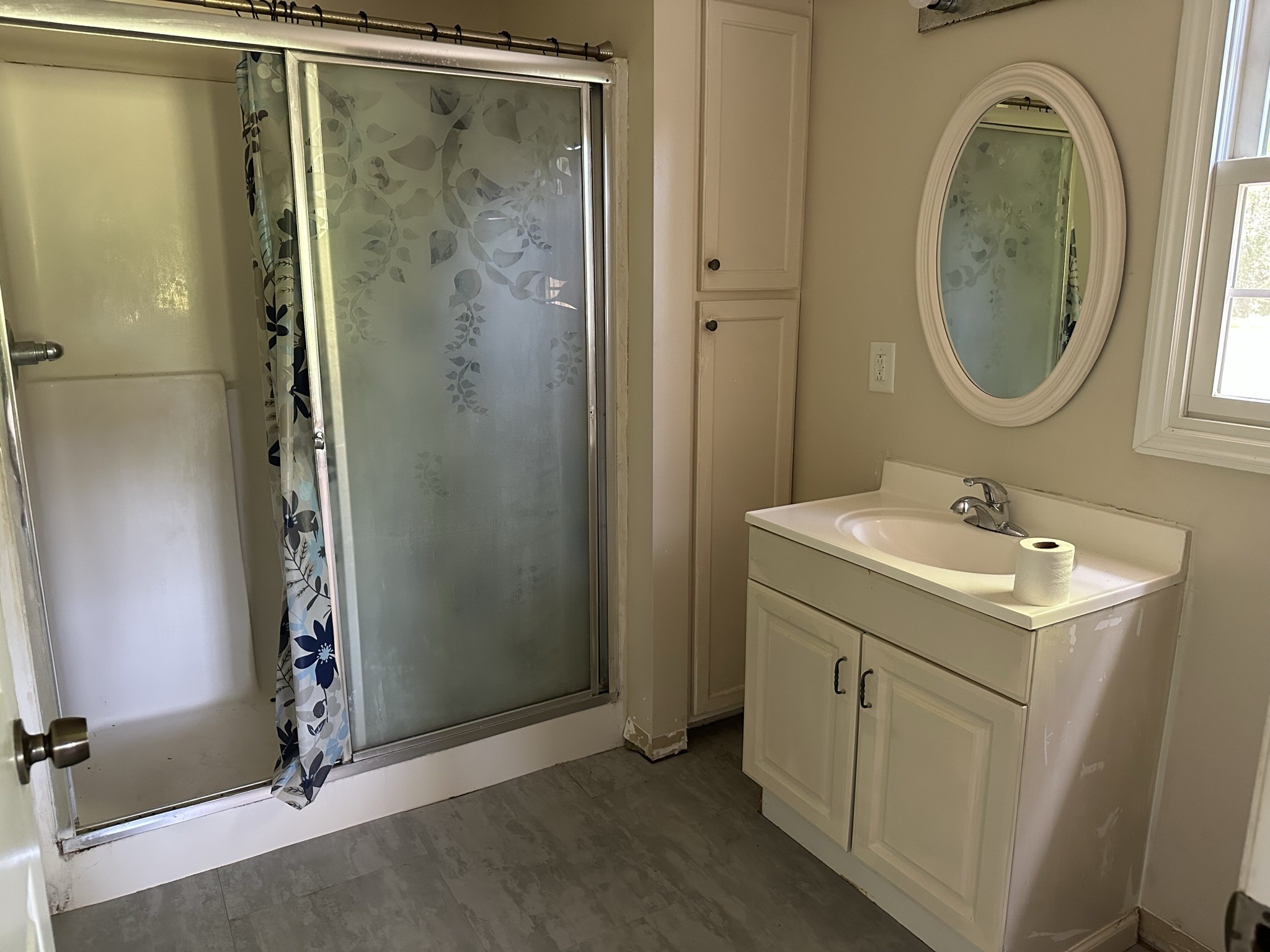 10026 Mona Road Murfreesboro, TN 37129 - Photo 54 of 64 a bathroom with a sink a mirror and a shower