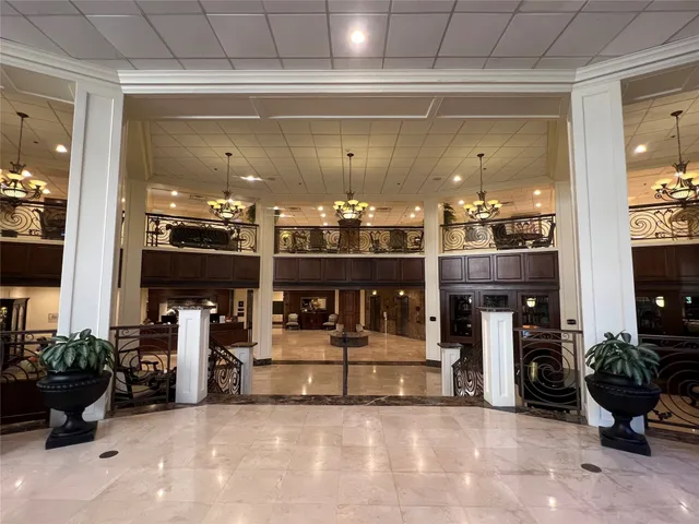 a room with lots of potted plants