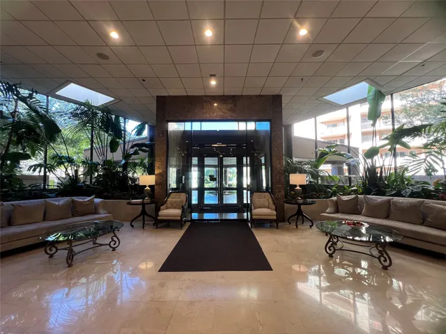 a lobby with furniture and outdoor seating