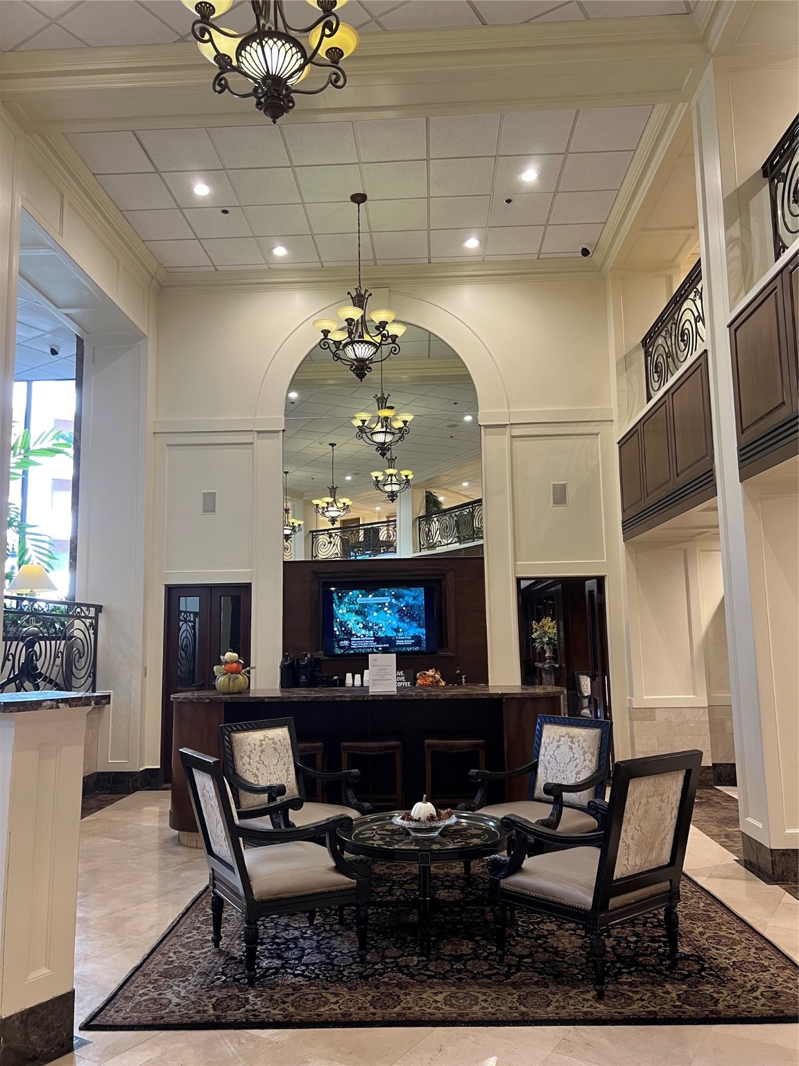3525 Sage Road, Unit 1218 Houston, TX 77056 - Photo 15 of 18 a living room with fireplace furniture and a chandelier