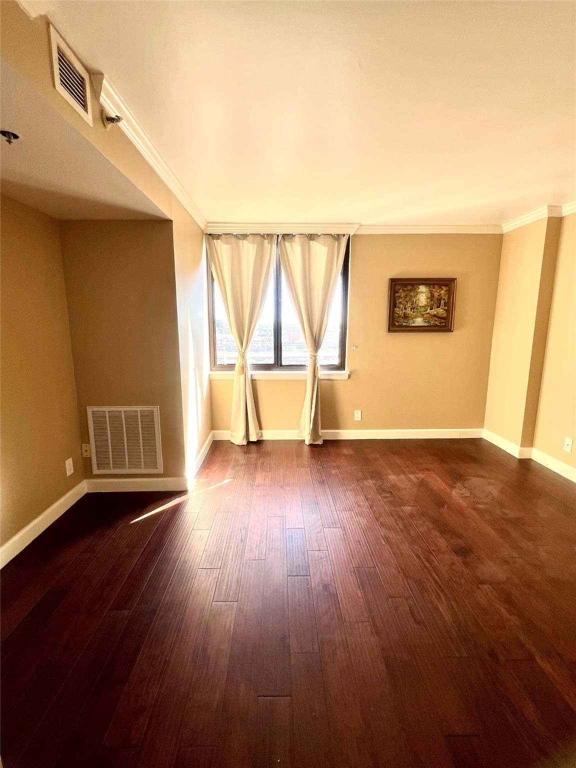 3525 Sage Road, Unit 1218 Houston, TX 77056 - Photo 7 of 18 a view of an empty room with wooden floor and a window