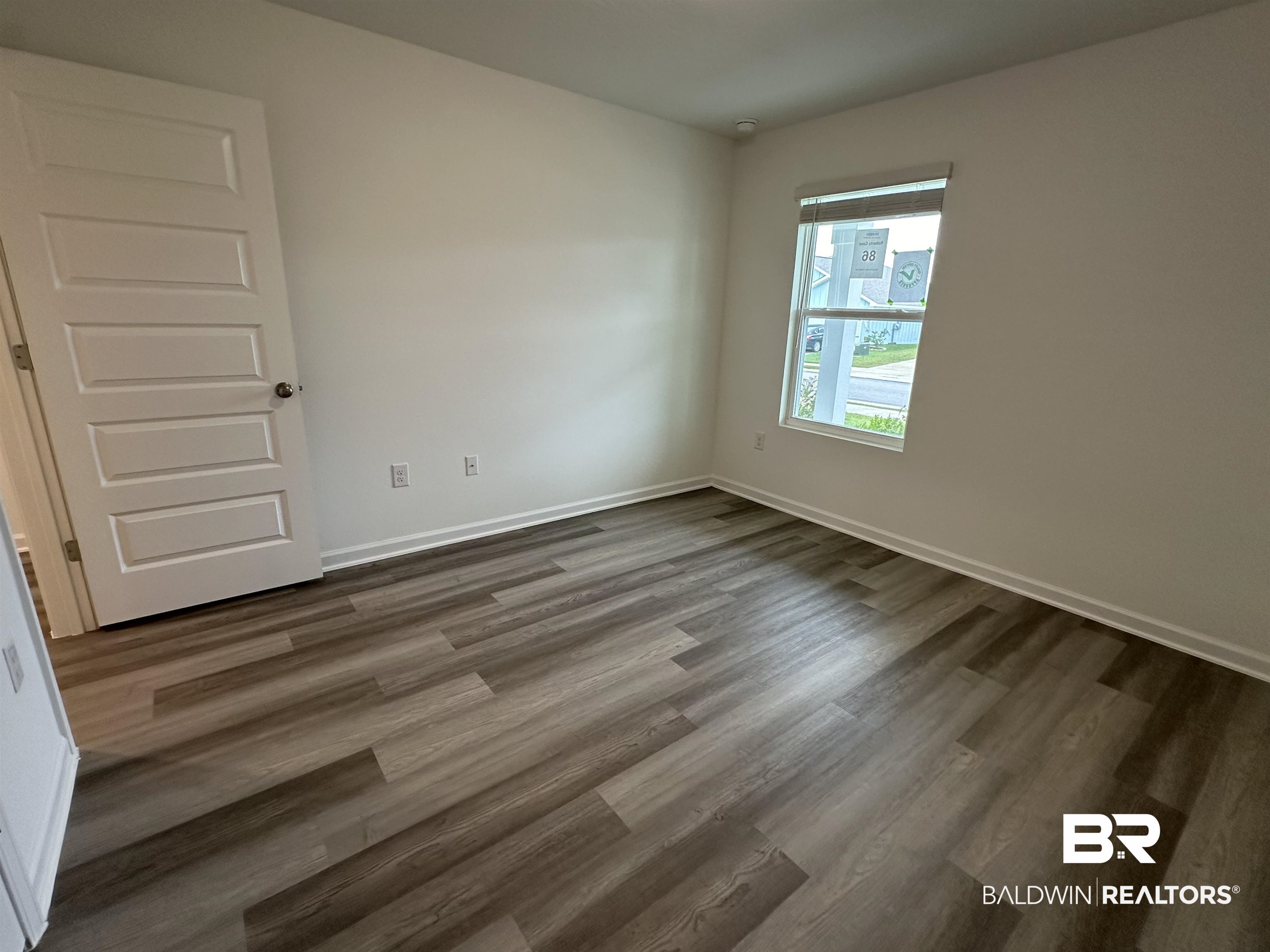 22275 Aleutian Avenue Foley, AL 36535 - Photo 22 of 72 Unfurnished room featuring dark hardwood / wood-style flooring
