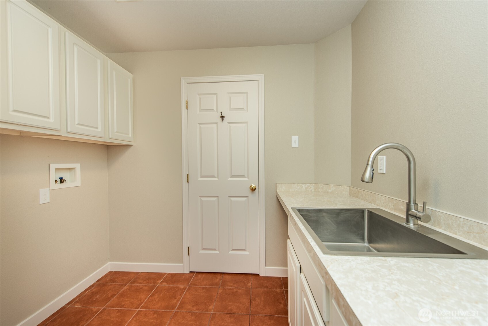 62 Pierson Lane Sequim, WA 98382 - Photo 20 of 40 a kitchen with granite countertop a sink a stove and cabinets