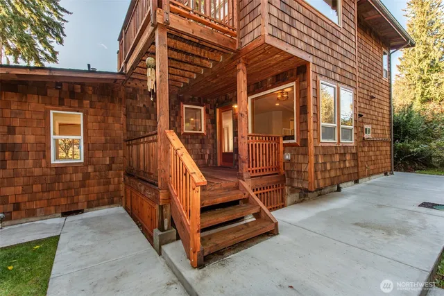 a view of a house with wooden fence