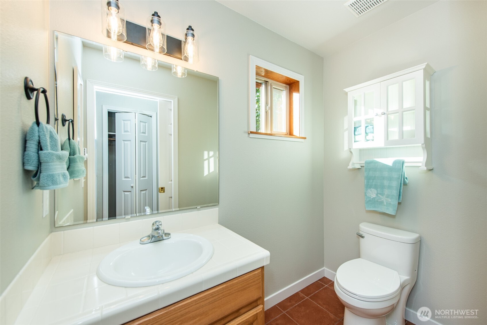 62 Pierson Lane Sequim, WA 98382 - Photo 21 of 40 a bathroom with a sink a toilet and a mirror