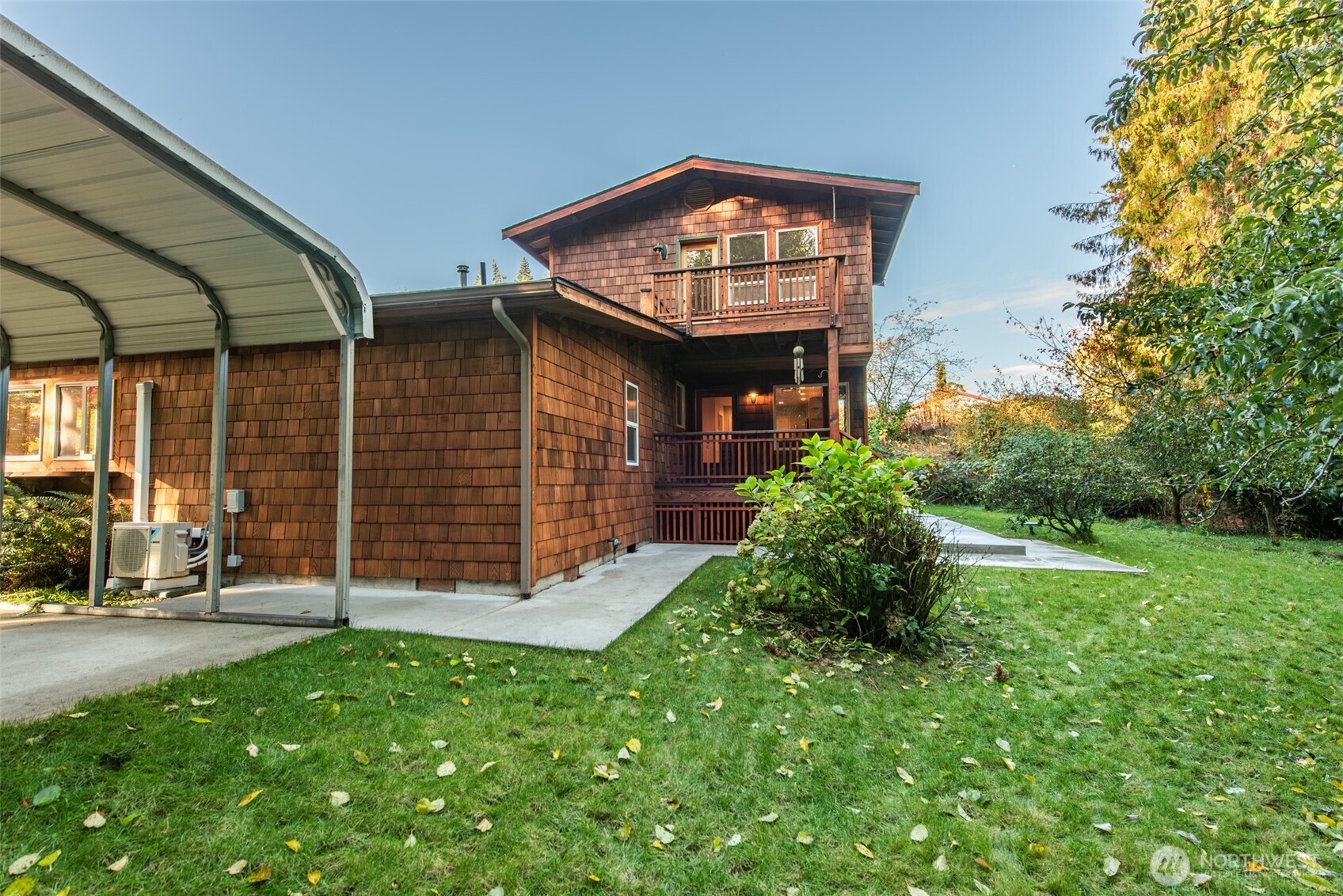 62 Pierson Lane Sequim, WA 98382 - Photo 3 of 40 a view of a brick house with a large window and a yard
