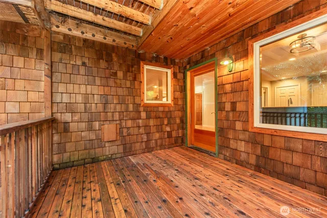 a view of a brick house with wooden floor and a window