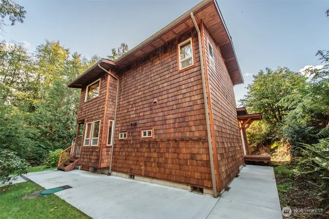 a brick building with a large tree
