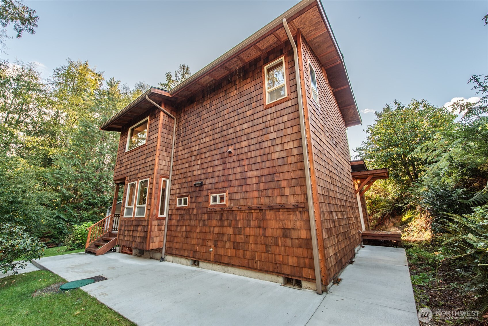 62 Pierson Lane Sequim, WA 98382 - Photo 36 of 40 a brick building with a large tree